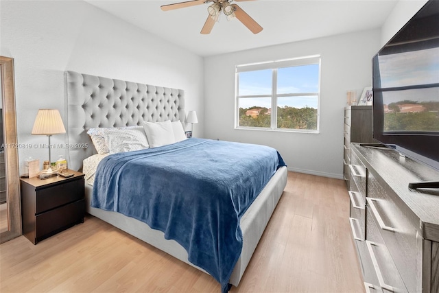 bedroom featuring ceiling fan and light hardwood / wood-style flooring