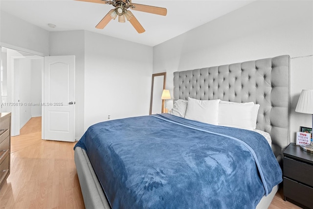 bedroom with ceiling fan and light hardwood / wood-style flooring