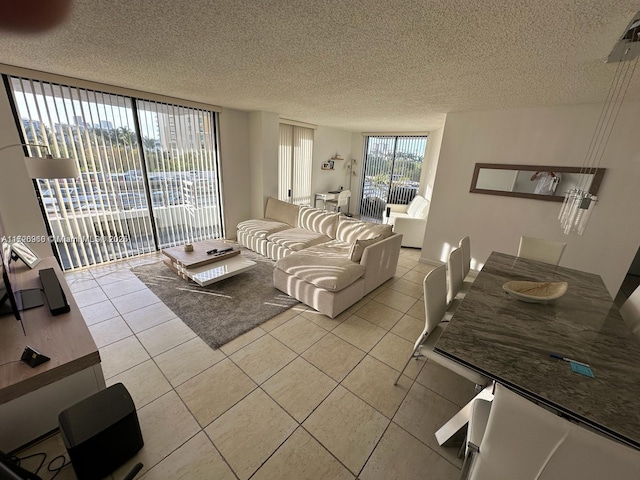 tiled living room featuring a textured ceiling