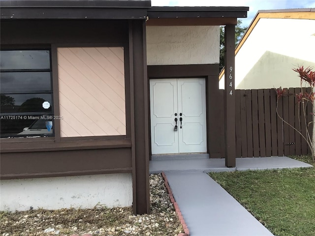 entrance to property featuring french doors