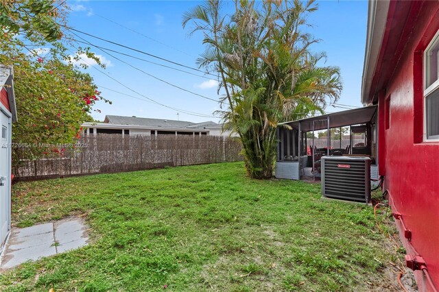 1916 SW 47th Ave, Fort Lauderdale, FL 33317 - view of yard with fence, central AC, and a sunroom