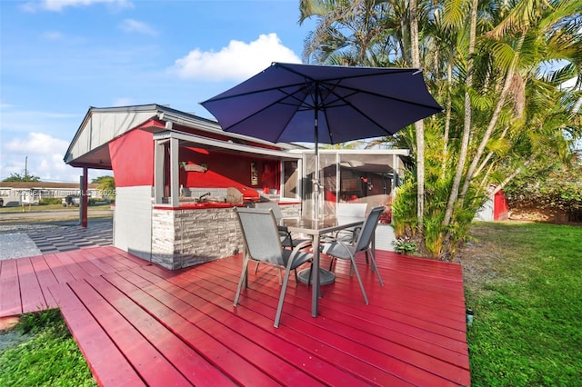 wooden deck with a lawn