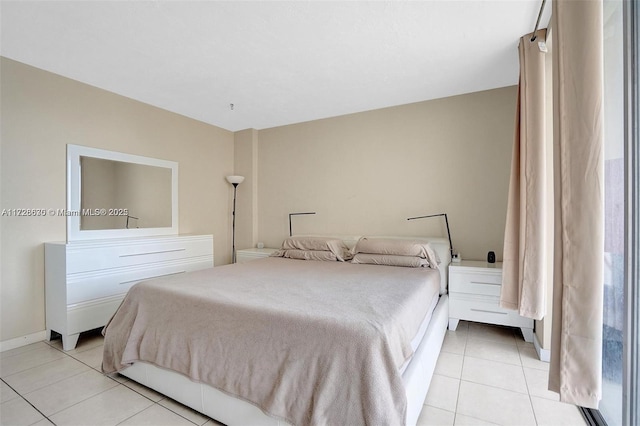 bedroom with light tile patterned floors