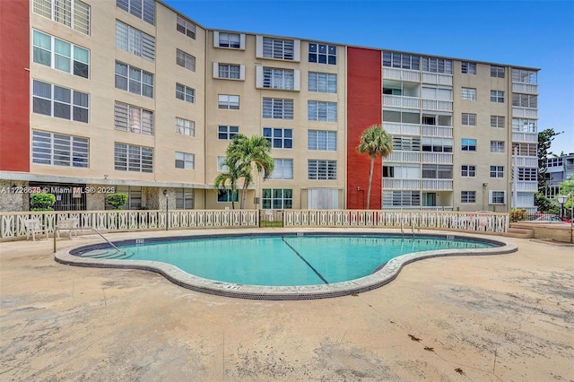 view of swimming pool featuring a patio area