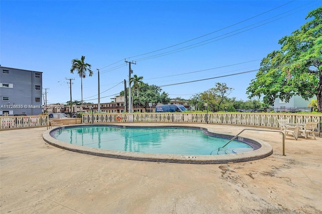 view of swimming pool with a patio area