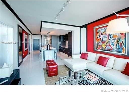 living room featuring crown molding and rail lighting