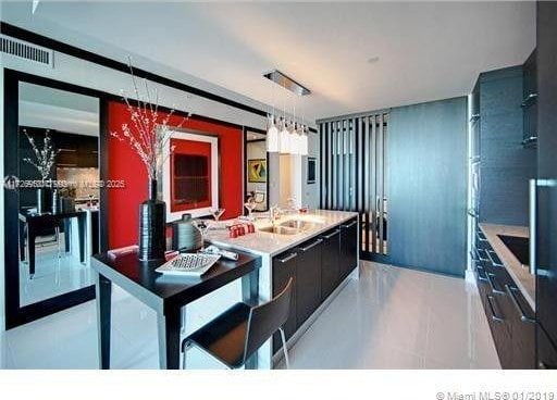 kitchen with hanging light fixtures and sink