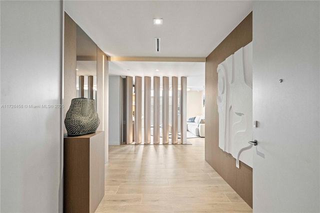 hallway featuring light wood-style flooring