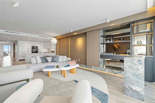 living area featuring light wood-type flooring