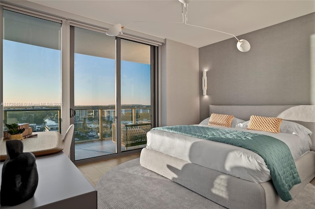 bedroom featuring access to exterior and expansive windows