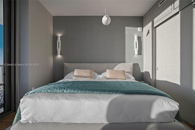 bedroom featuring wood finished floors