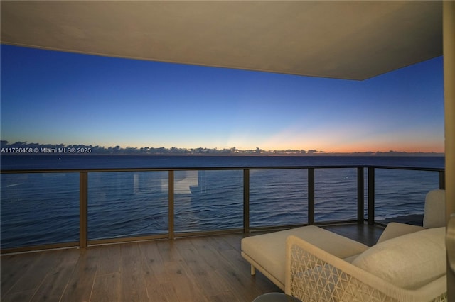 balcony at dusk with a water view