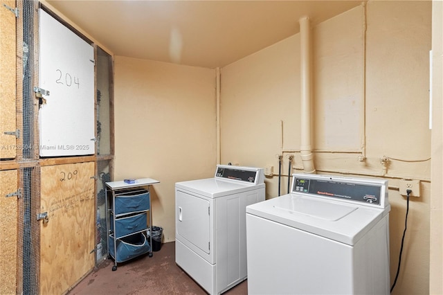 washroom with independent washer and dryer