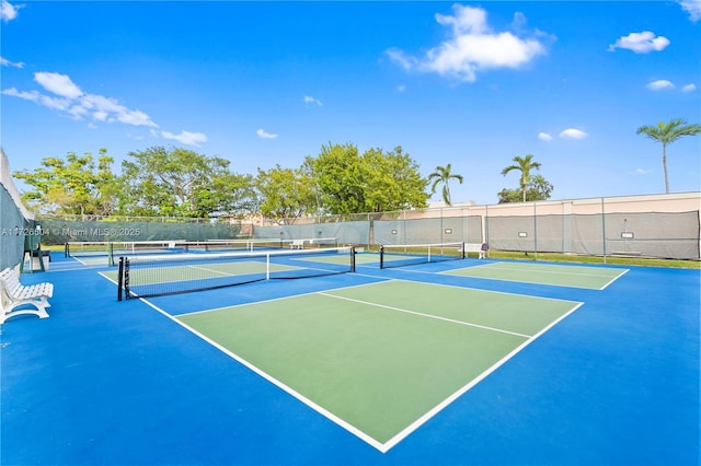 view of sport court with basketball hoop