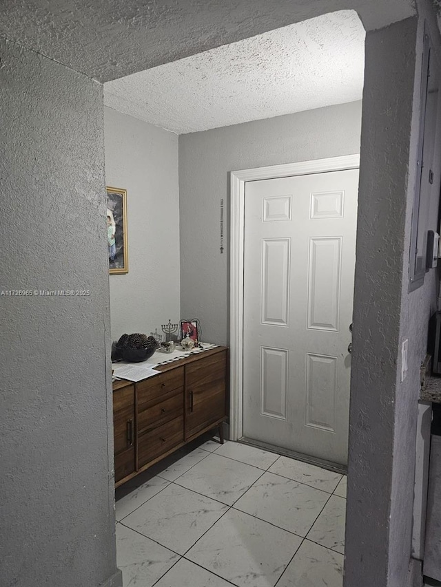 bathroom featuring a textured ceiling