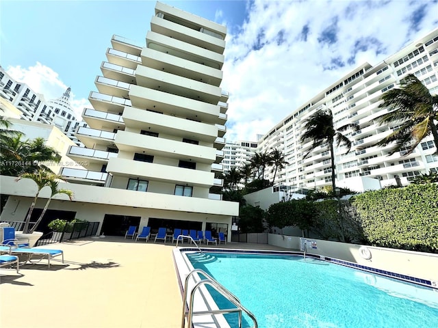 view of swimming pool with a patio area