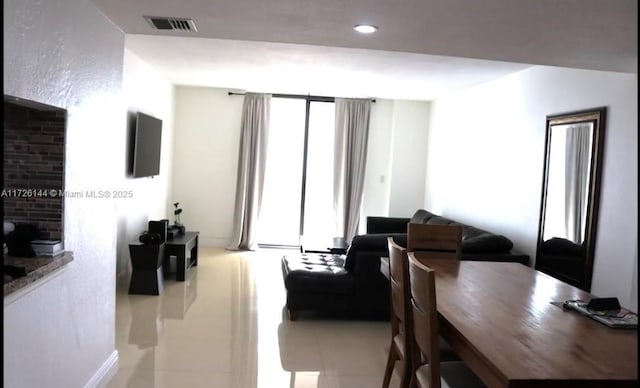 1621 Collins Ave Unit 310, Miami Beach, FL 33139 - tiled living area featuring visible vents, recessed lighting, and baseboards
