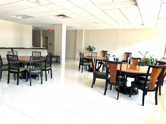 1621 Collins Ave Unit 310, Miami Beach, FL 33139 - dining room with visible vents, a drop ceiling, and light tile patterned floors