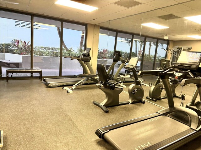 1621 Collins Ave Unit 310, Miami Beach, FL 33139 - gym with floor to ceiling windows and a paneled ceiling