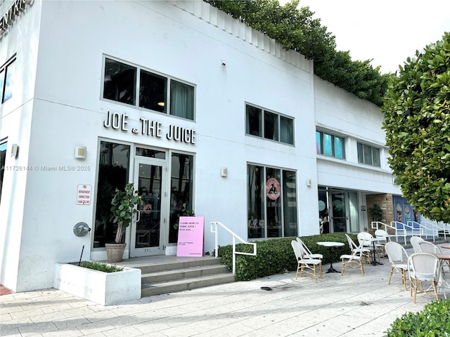 1621 Collins Ave Unit 310, Miami Beach, FL 33139 - rear view of house featuring stucco siding