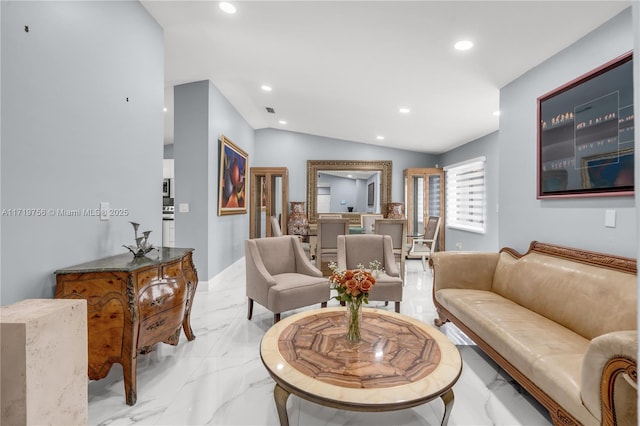 living room featuring vaulted ceiling