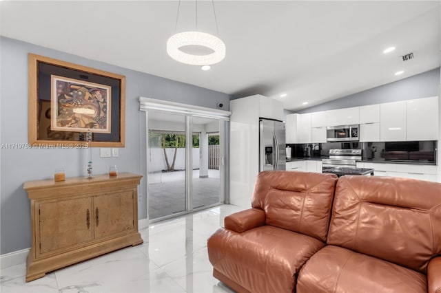 living room featuring vaulted ceiling