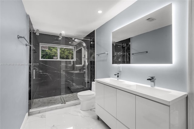 bathroom with toilet, vanity, and walk in shower