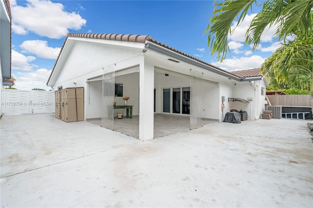 rear view of property featuring a patio