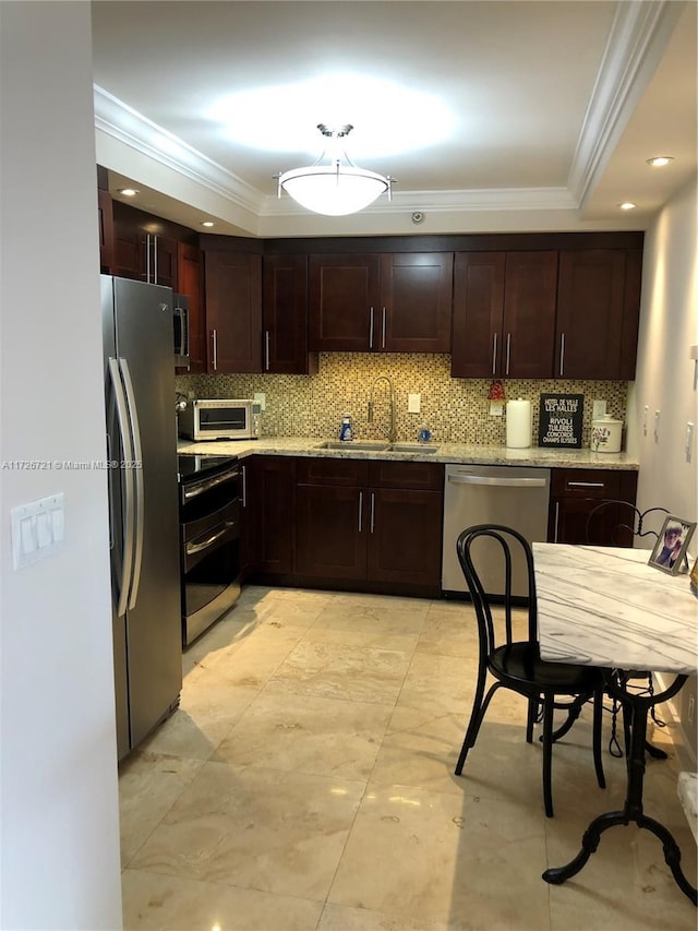 kitchen with stainless steel appliances, crown molding, sink, and backsplash