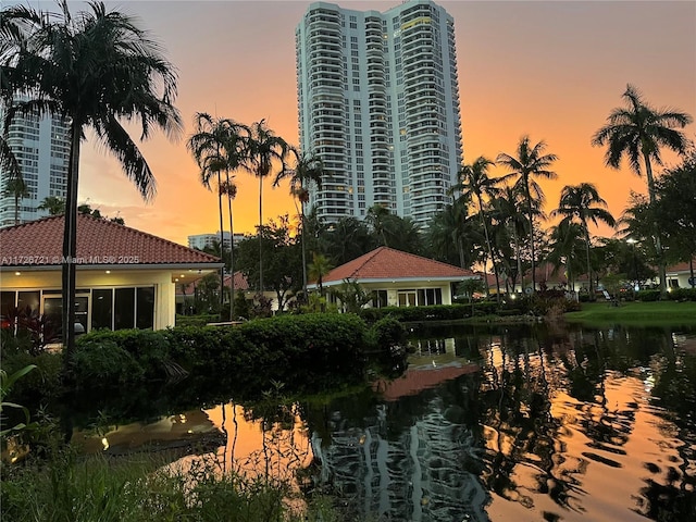 outdoor building at dusk featuring a water view