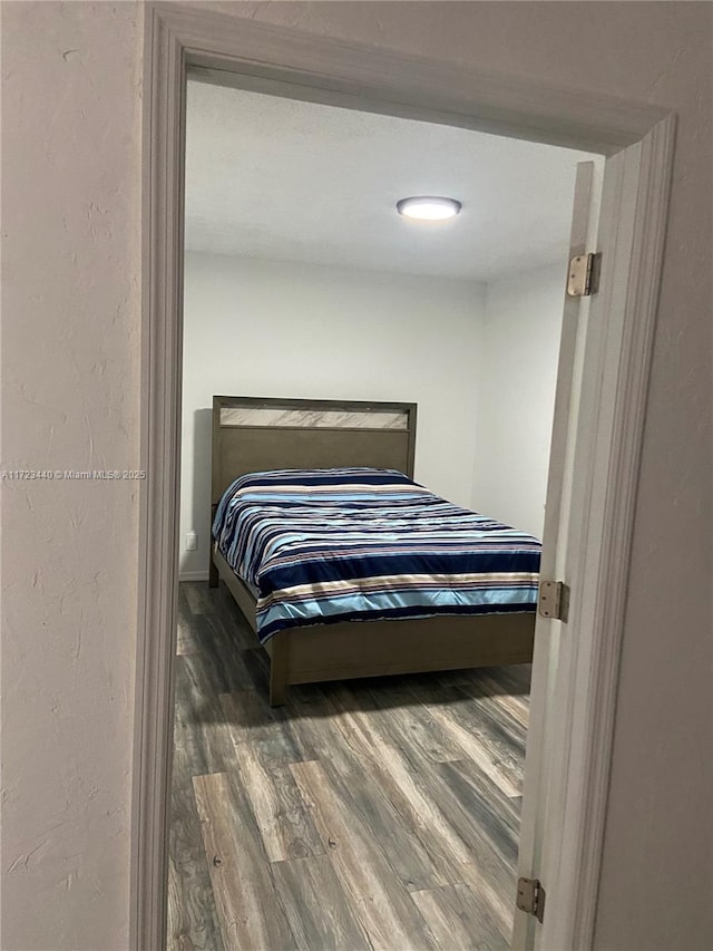 bedroom featuring wood-type flooring