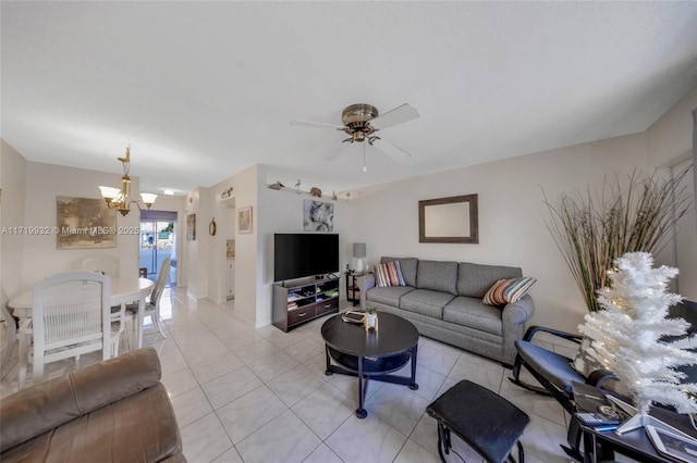 tiled living room featuring ceiling fan with notable chandelier