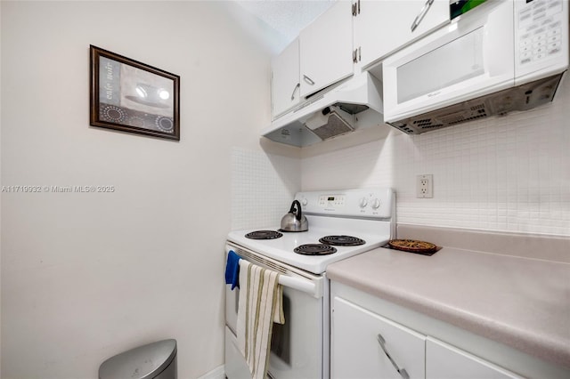 kitchen featuring decorative backsplash, white appliances, and white cabinets