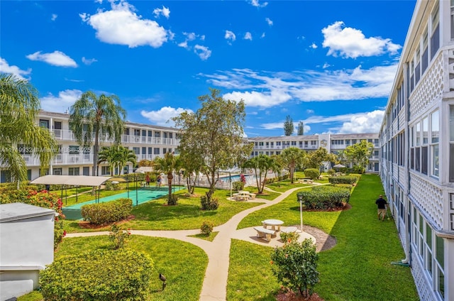 view of property's community featuring a lawn