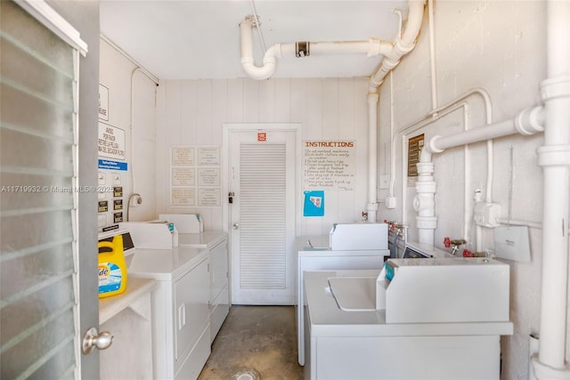 clothes washing area featuring washing machine and clothes dryer