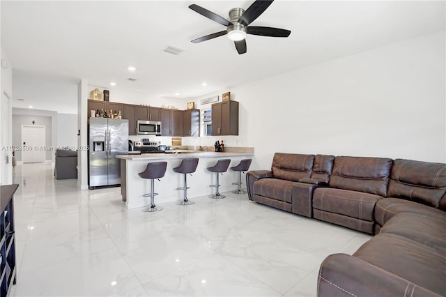 living room with ceiling fan