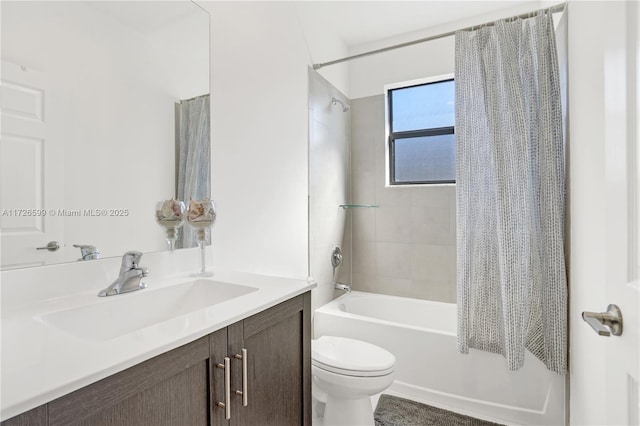 full bathroom with shower / bath combo with shower curtain, toilet, and vanity