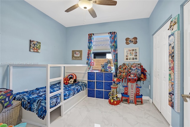 bedroom with ceiling fan and a closet