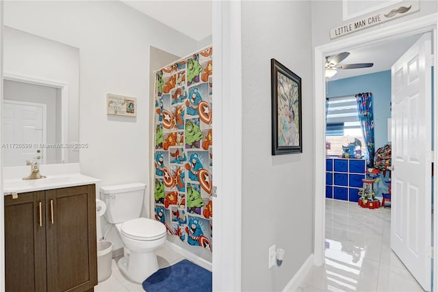 bathroom featuring toilet, ceiling fan, tile patterned floors, walk in shower, and vanity