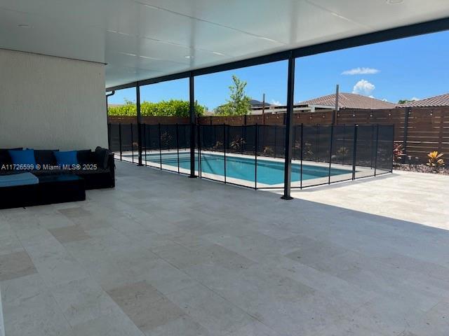 view of pool featuring a patio