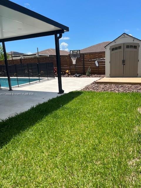 view of yard with a patio area and a shed