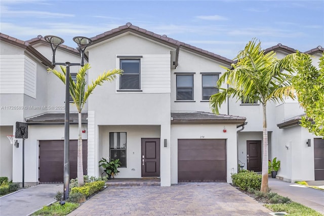 townhome / multi-family property featuring a garage