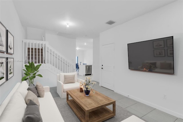 living room with light tile patterned flooring