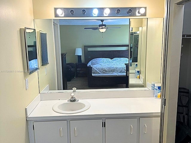 bathroom featuring a ceiling fan, vanity, and ensuite bathroom