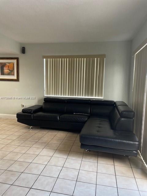 living room featuring light tile patterned floors