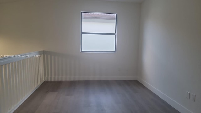 571 SE 37th Pl, Homestead, FL 33033 - spare room with dark hardwood / wood-style flooring