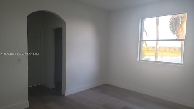 571 SE 37th Pl, Homestead, FL 33033 - empty room featuring a healthy amount of sunlight and dark wood-type flooring