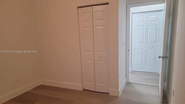 571 SE 37th Pl, Homestead, FL 33033 - unfurnished bedroom with hardwood / wood-style floors and a closet