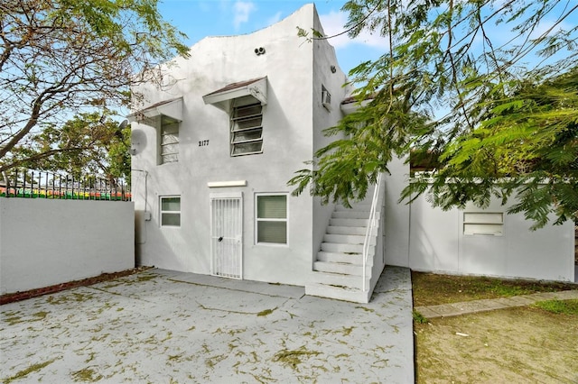 rear view of property featuring a patio