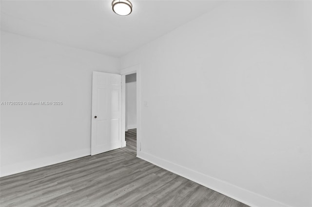 unfurnished room featuring hardwood / wood-style floors